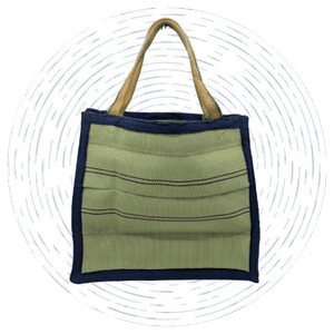A large green prototype tote made out of retired fire hoses.