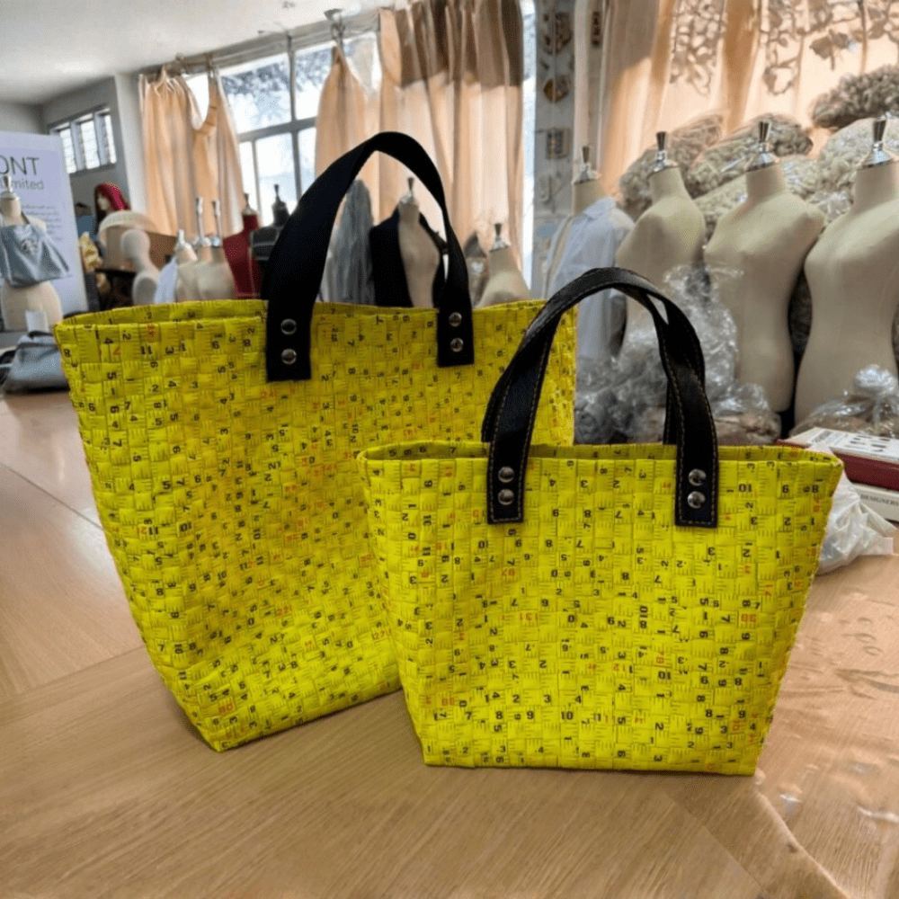 A couple of handmade baskets woven out of tape measure waste from a project with a rural community in Thailand.