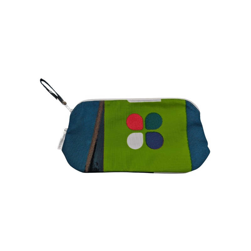 One of Morph's cosmetic bags with bright green, dark blue and dots in the design.