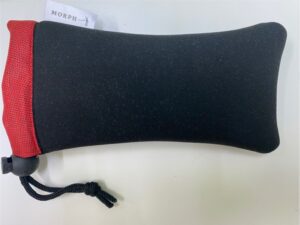 A Morph sunglass case made from black diving suit neoprene waste.