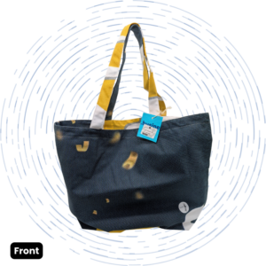 The front view of a one-of-a-kind dark navy Large Morph Tote with scattered mustard-yellow shapes and yellow, white, and gray striped straps.