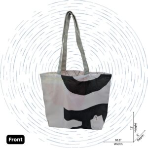 The front view of a one-of-a-kind white Upcycled Tote with an abstract black pattern.