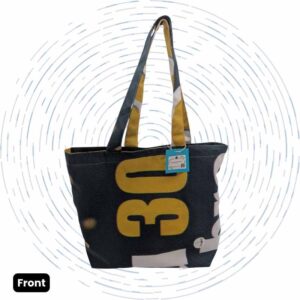 The front view of a one-of-a-kind tote bag featuring a bold yellow "30" graphic against a dark background, with dark blue, white, and yellow handles.